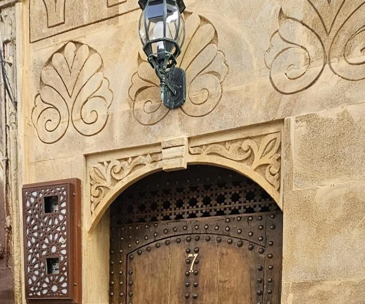 The lantern and the brass 7 over the door