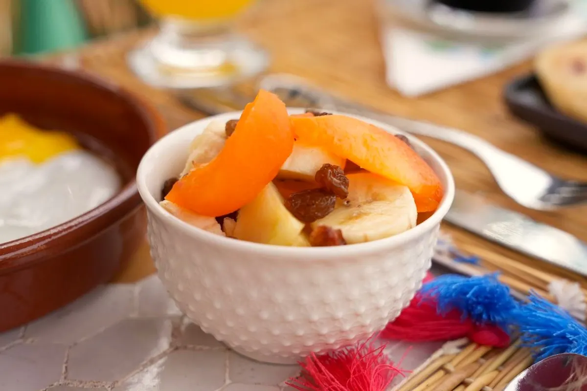 Fruit salad on a tasselled place mat
