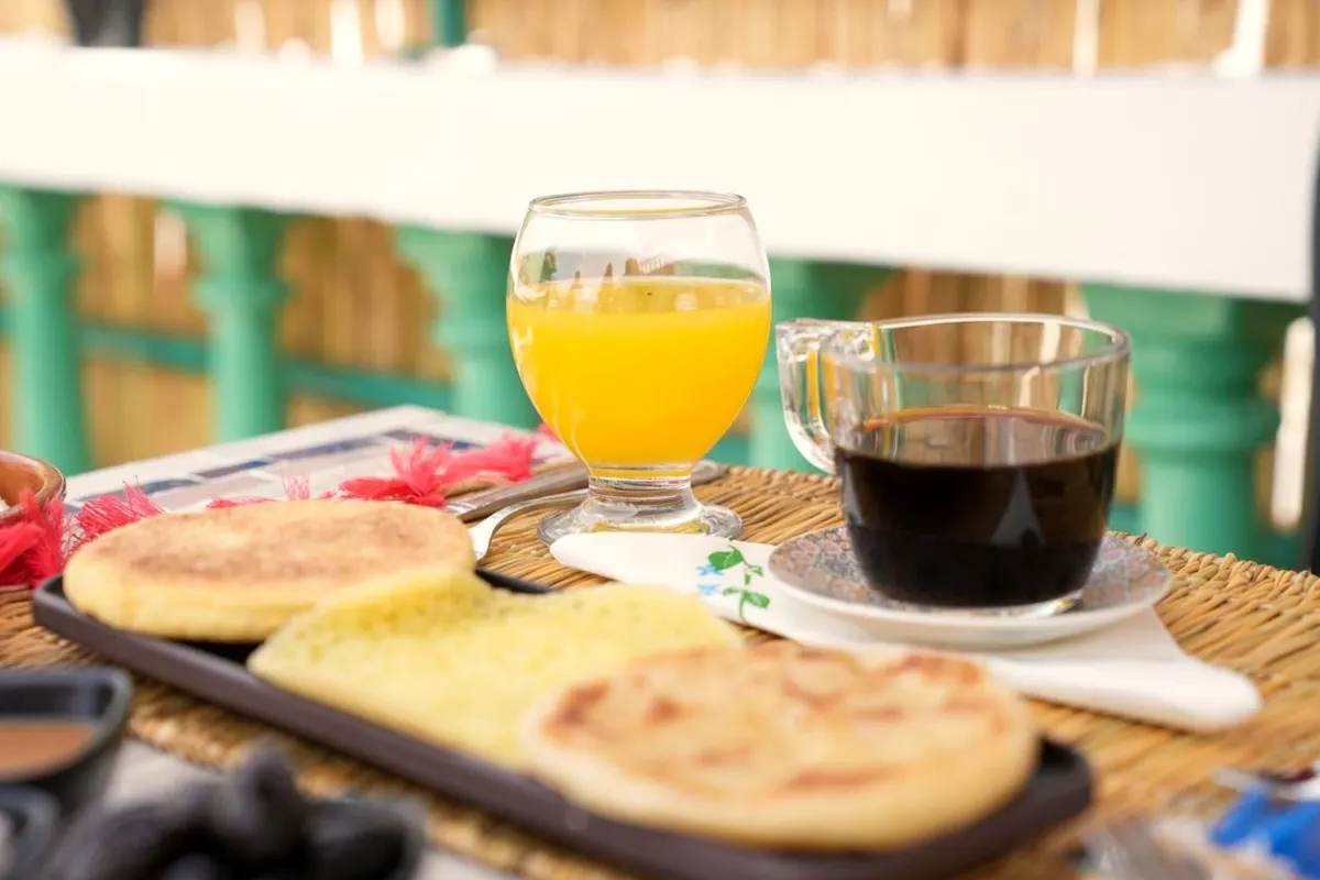 Orange juice, coffee, harcha and msemen